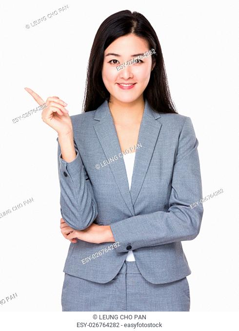 Young businesswoman with finger point up
