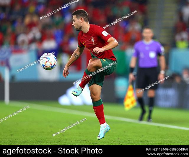 24 November 2022, Qatar, Doha: Soccer: World Cup, Portugal - Ghana, Preliminary round, Group H, Matchday 1, Stadium 974, Raphael Guerreiro of Portugal in action