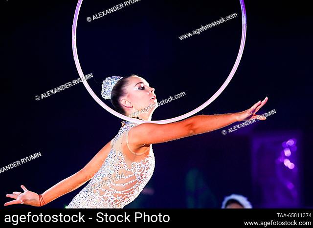 RUSSIA, NIZHNY NOVGOROD - DECEMBER 16, 2023: Rhythmic gymnast Arina Averina performs during the Swan Lake gymnastics show at the Nagorny cultural and...