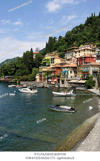 View of lakeside village and boats, Varenna, Lake Como, Lombardy, Italy