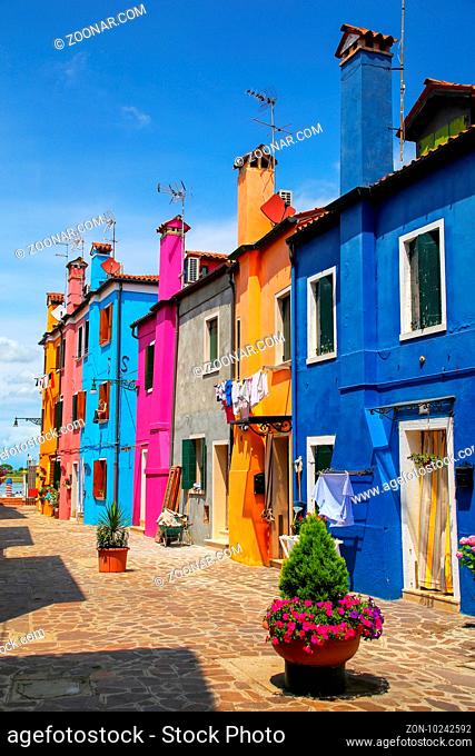 Colorful houses in Burano, Venice, Italy. Burano is an island in the Venetian Lagoon and is known for its lace work and brightly colored homes