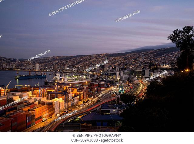View of city and ports at dusk from Paseo 21 de Mayo, Cerro Playa Ancha, Valparaiso, Central Coast, Chile