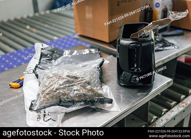 21 October 2022, North Rhine-Westphalia, Cologne: A bag of marijuana lies next to a toaster in which the bag was hidden. In search of drugs