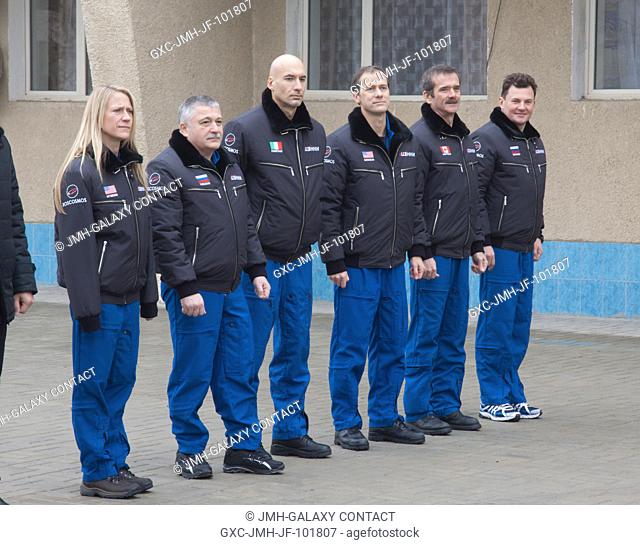 Outside their Cosmonaut Hotel crew quarters in Baikonur, Kazakhstan Dec. 9, 2012, the Expedition 34 backup and prime crew members are attentive during remarks...