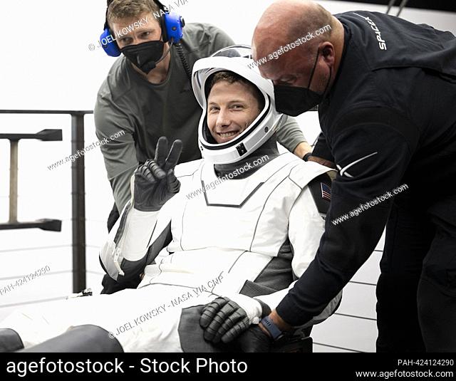 NASA astronaut Warren ""Woody"" Hoburg helped out of the SpaceX Dragon Endeavour spacecraft onboard the SpaceX recovery ship MEGAN after he