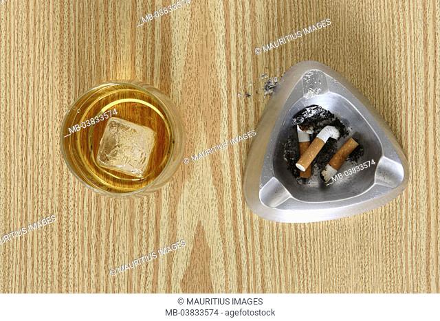 Wood table, ashtrays, ,  Cigarette butts, Cognacschwenker, ,  from above,  Series, table, wood surface, Ascher, filter cigarettes, butts, brandy glass, Cognac