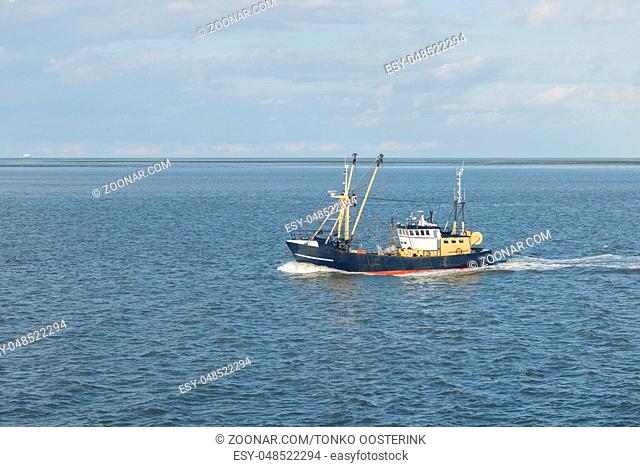 Fishing boat on the Wadden Sea near the island of Vlieland in the North of the Netherlands