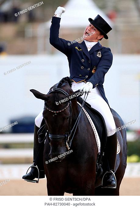 Isabell Werth of Germany on horse Weihegold Old celebrates after performing during the Dressage Individual and Team Grand Prix Special of the Equestrian events...