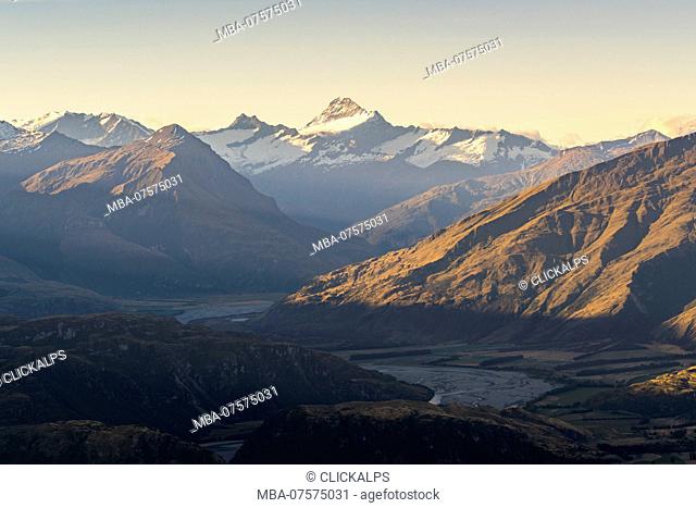 Last rays of light on Mt Aspiring seen from Roys Peak lookout, Wanaka, Queenstown Lakes district, Otago region, South Island, New Zealand