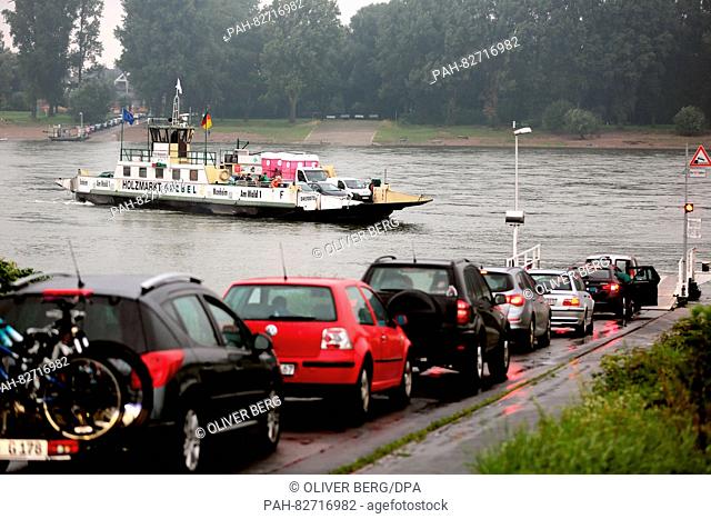 Cars line up waiting to board the Rhine ferry which connects Cologne and Leverkusen in Cologne, Germany, 12 August 2016. Numerous commuters had to use the ferry...