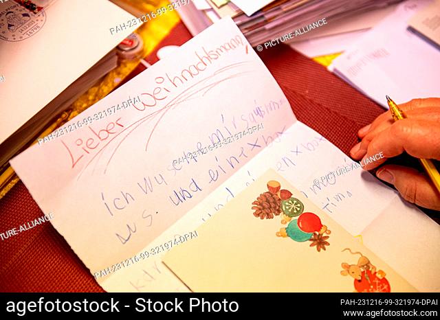 16 December 2023, Brandenburg, Himmelpfort: Christmas angels sort and answer children's letters to Santa Claus at the Christmas post office in northern...