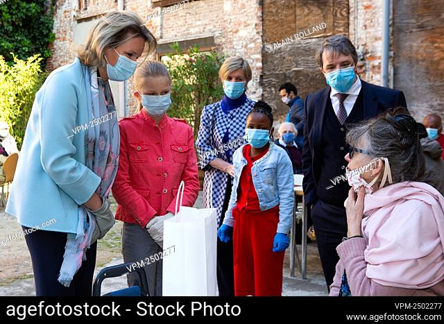 Queen Mathilde of Belgium and Princess Eleonore wear a mouth mask at a royal visit to the Kamiano restaurant of the homeless shelter of the Sant Egidio...