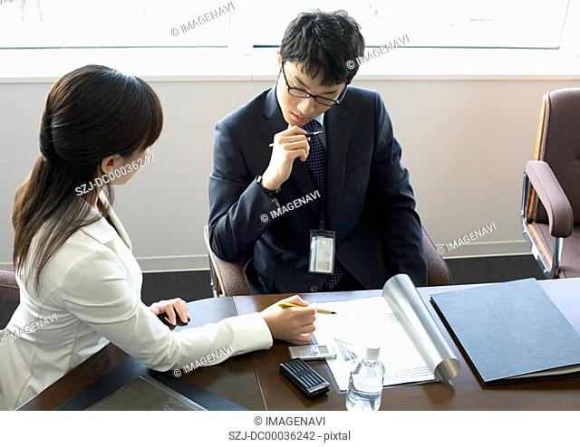 Businessman and businesswoman have a meeting