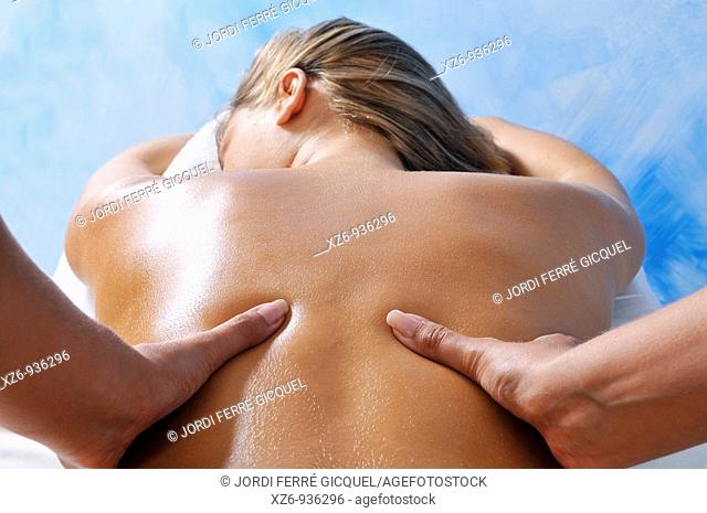Close up of a young woman getting back massage