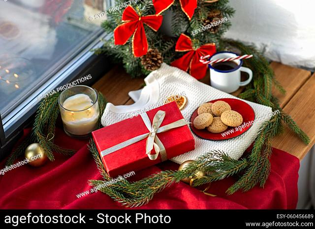 christmas gift, cookies, candle and fir branch