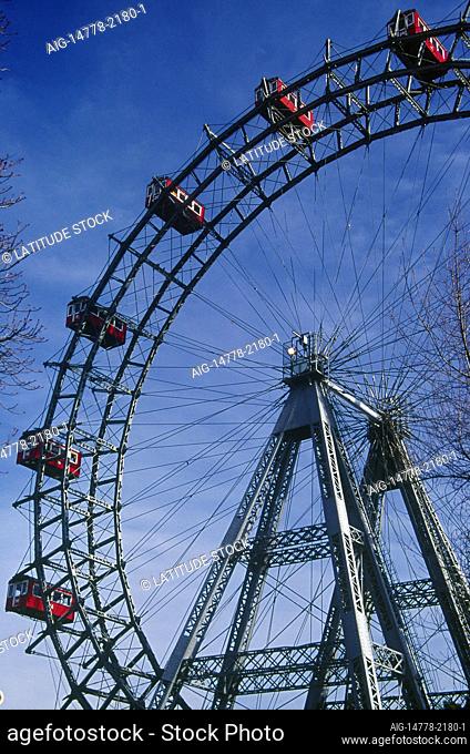Reisenrad. Ferris wheel. Prater park. Red passenger cabins, gondolas