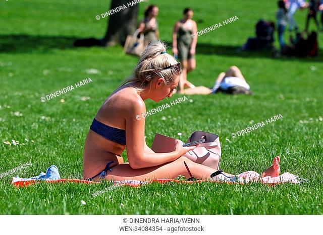 Tourist and Londoners enjoy third day of hot weather in Green Park and St. James's Park as the temperatures in the capital likely to reach 26 degree celsius