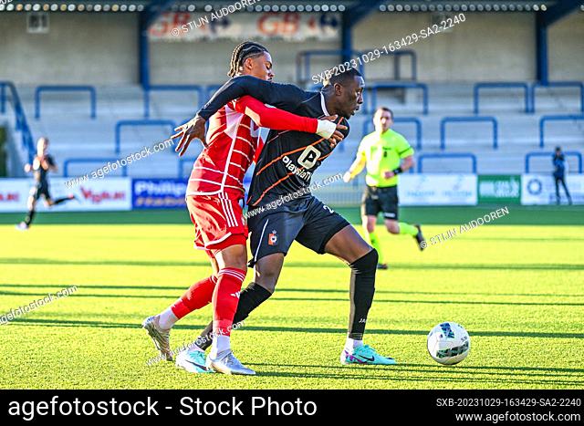Noubi Ngnokam Lucas Dominique (41) of Standard SL16 FC and Souleymane Anne (22) of KMSK Deinze pictured during a soccer game between SL16 FC and KMSK Deinze...