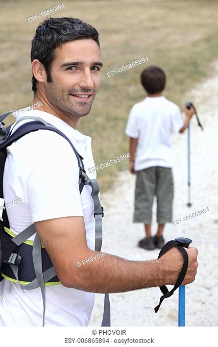 a father and his son hiking