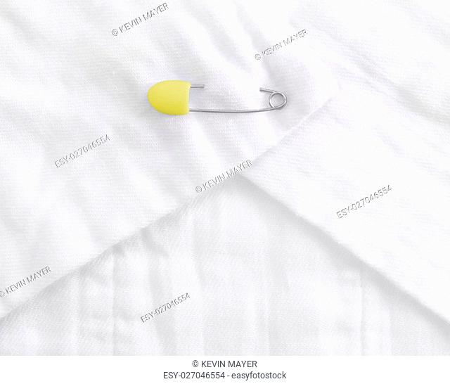 Baby cloth diaper with a yellow safety pin