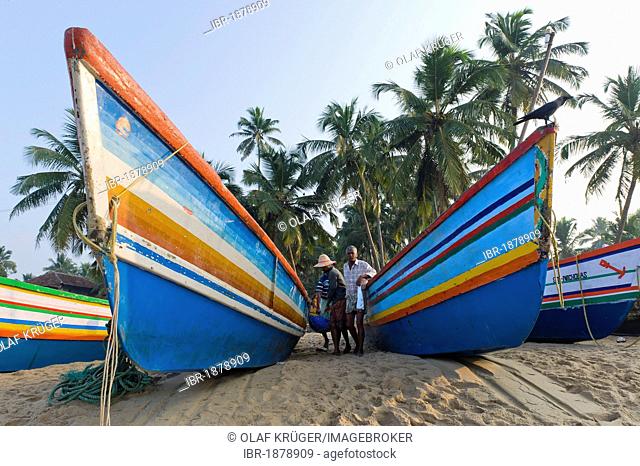 Fishing boats on a beach, Bekal, North Kerala, Kerala, India, Asia