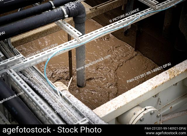 PRODUCTION - 30 November 2023, Lower Saxony, Wittmund: Washed sludge in the soil washing plant on the site of the Wittmund NATO airbase