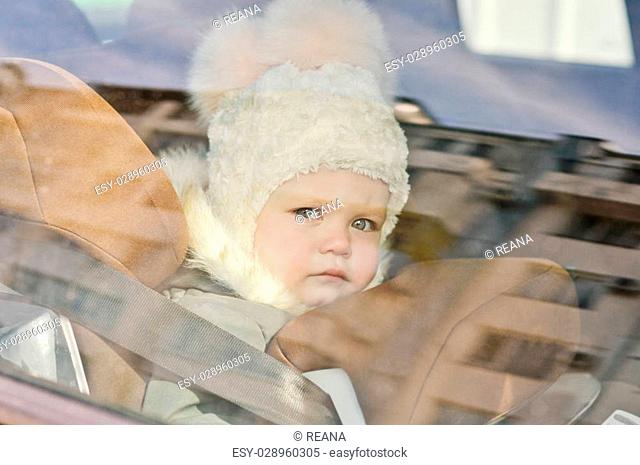 baby in the car in car seat in winter time