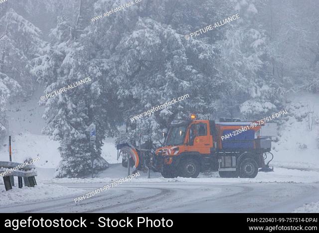 01 April 2022, Baden-Wuerttemberg, Freiburg: A snow removal vehicle of the Breisgau-Hochschwarzwald district stands near the mountain station of the...