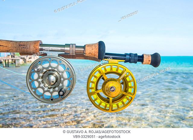 Saltwater fly fishing fly rod and reel an the beach in Caribbean sea - los roques