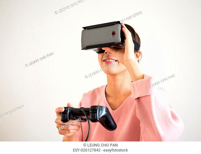 Asian Woman play with the virtual reality device