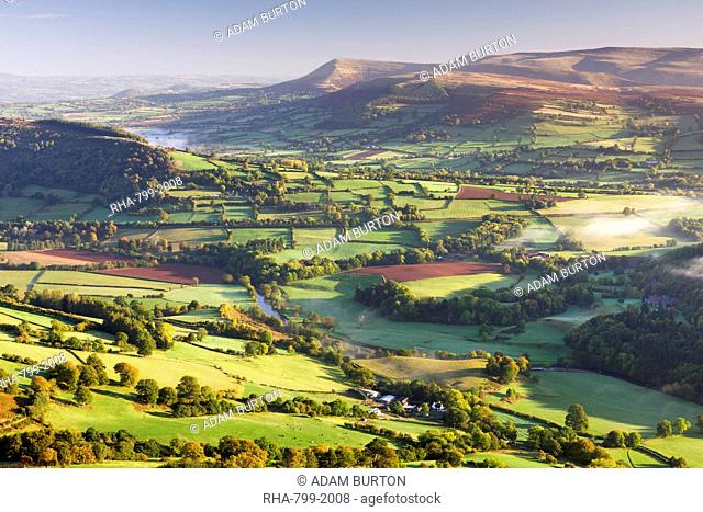 Morning sunshines illuminates the patchwork fields in the Usk Valley, looking towards the Black Mountains, Brecon Beacons, Wales, United Kingdom, Europe