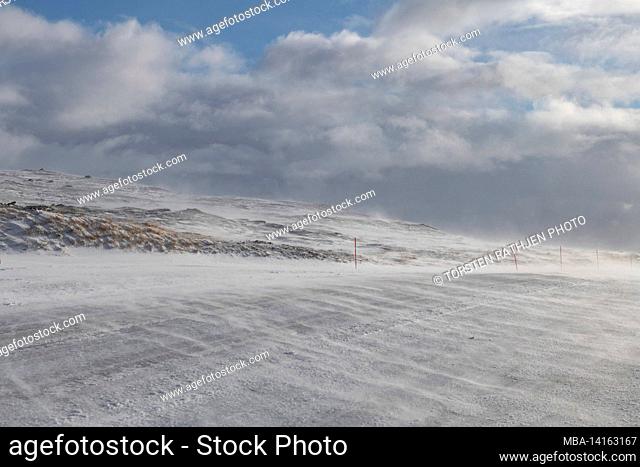 snowdrifts on a pass road, cloud front, tydal, norway