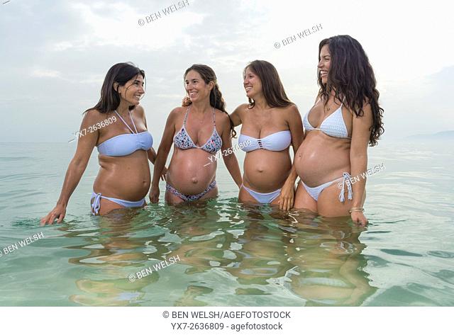 Pregnant women at the beach. Tarifa, Costa de la Luz, Cadiz, Andalusia, Southern Spain, Europe