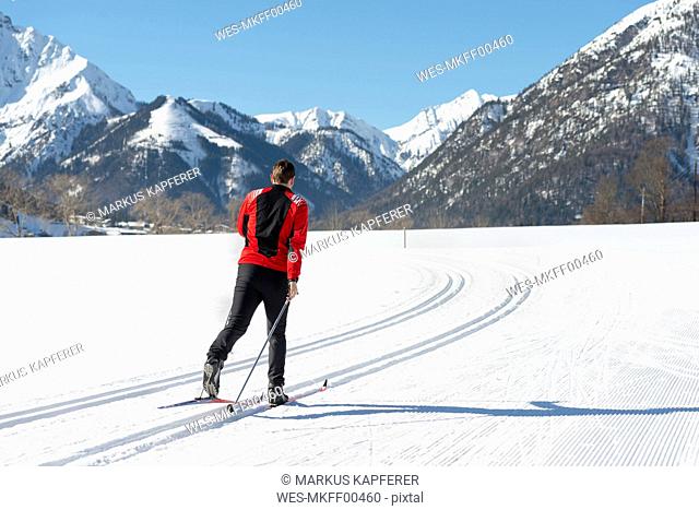 Austria, Tyrol, Achensee, man doing cross country skiing