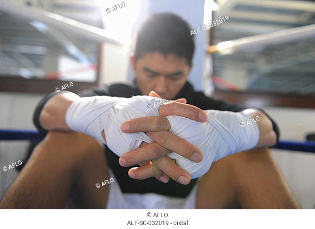 Boxer wearing bandage in his both hands