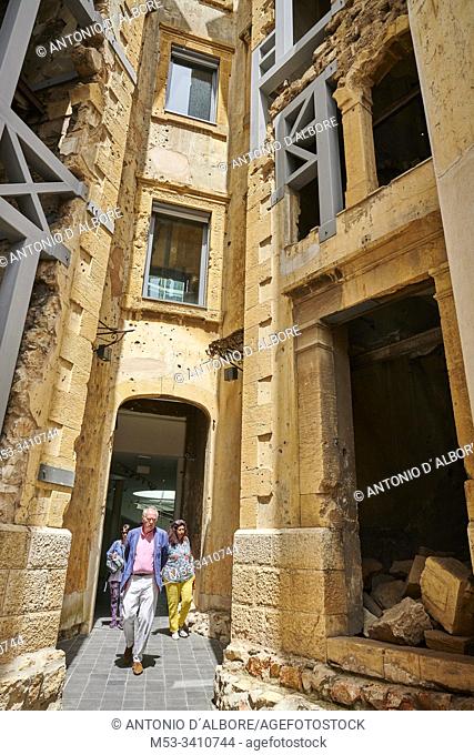 A small group of people visiting House of Beirut, formerly known as Barakat House. This building was used by snipers during the civil war and has now been...