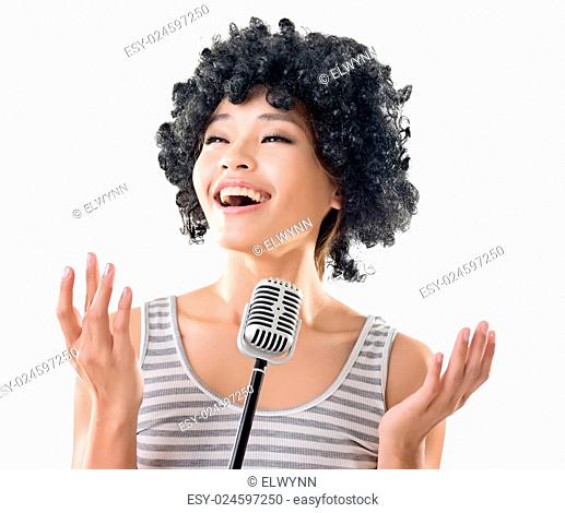 Young Asian woman singing, closeup portrait