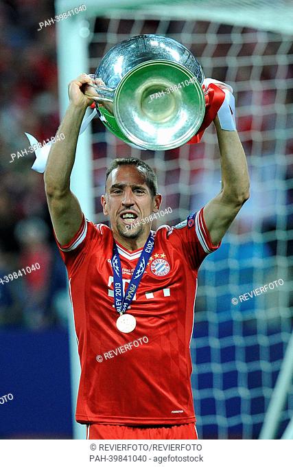 Munich's Franck Ribery celebrates with the Champions League trophy after the Champions League final between German soccer clubs Borussia Dortmund (BVB)and...
