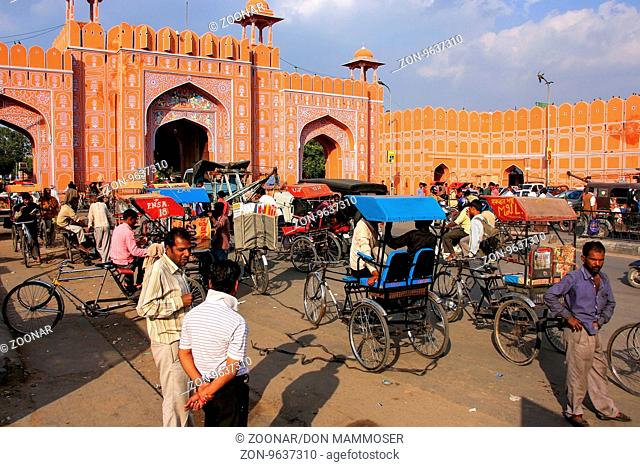 Ajmeri Gate with cycle rickshaws in front of it, Jaipur, Rajasthan, India. There are seven gates in the walsl of Jaipur old town