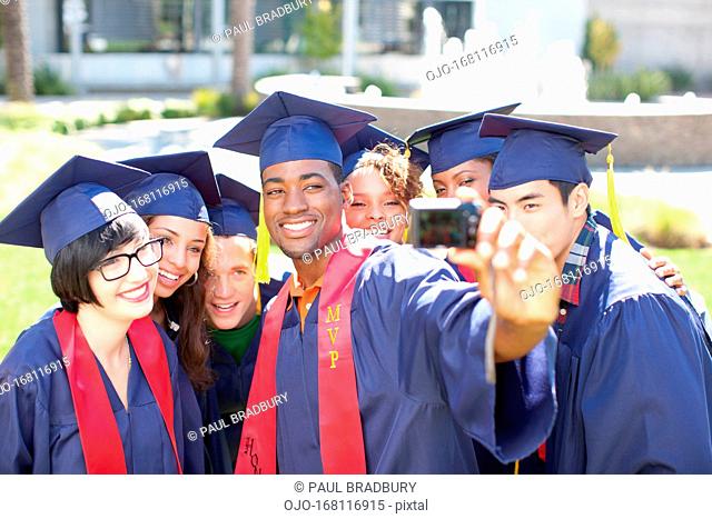 Graduates taking picture of themselves