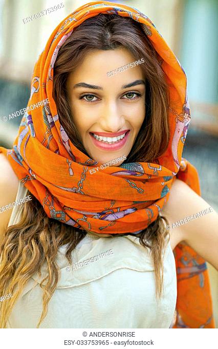 Close up portrait of a muslim young woman wearing a head scarf, indoor