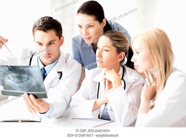 group of doctors looking at x-ray
