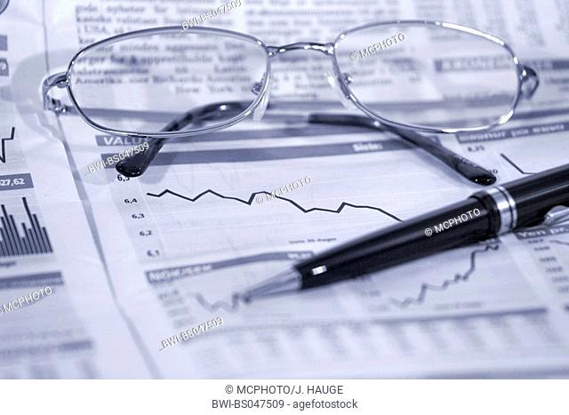 glasses and ballpen on top of financial numbers with stock price