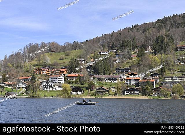 Easter 2022 at Tegernsee. View over the Tegernsee to houses on a hillside in the municipality of Tegernsee on April 18th, 2022