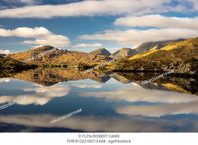 View of mountains and clouds reflected in lake, Upper Lake, Lakes of Killarney, Killarney N.P., County Kerry, Munster, Ireland, November