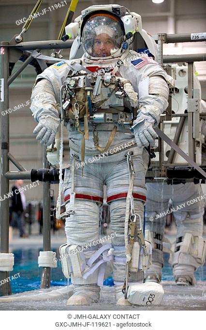 Astronaut Jeffrey Williams, Expedition 21 flight engineer and Expedition 22 commander, attired in a training version of the Extravehicular Mobility Unit (EMU)...