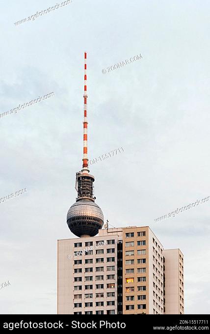 Berlin, Germany - July 29, 2019: Fernsehturm, Television tower and residential building against sky