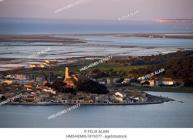 France, Aude, Gruissan, the village and the tower Barbarossa surrounded by the sea and ponds, seen from the massive Clape