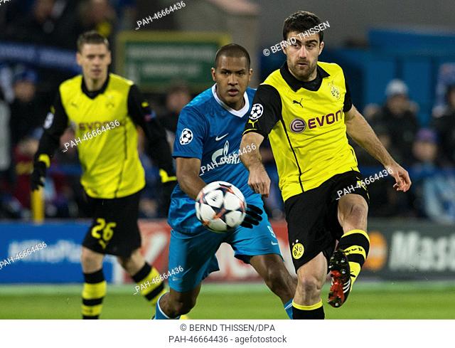 Dortmund's Sokratis (R-L) vies for the Ball with Zenit's Jose Salomon Rondon during the UEFA Champions League round of 16 first leg soccer match between Zenit...