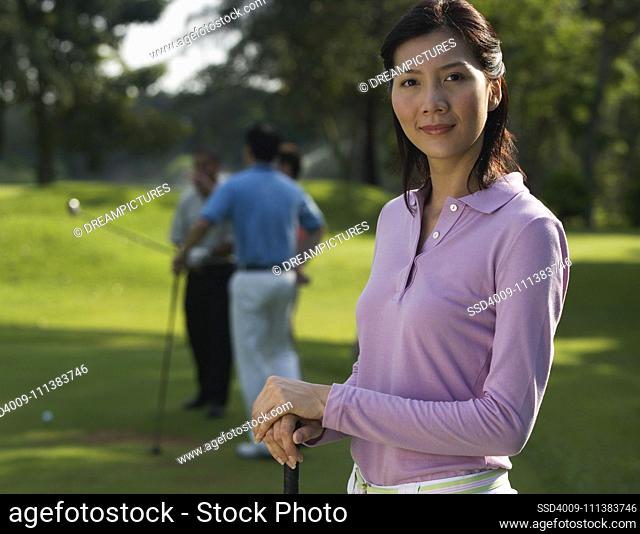Chinese woman playing golf